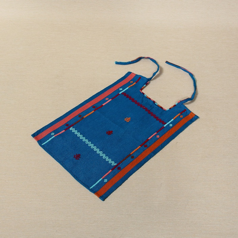 Handwoven cotton bib with embroidered borders and frog motifs, Oaxaca Mexico